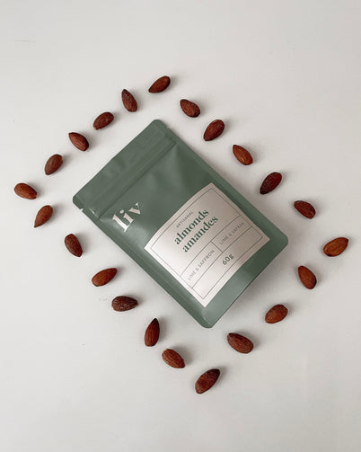 LIV’s hand-roasted almonds in a six-pack bundle featuring Lightly Salted, Lime & Saffron, and Mild Spicy flavours; crafted in small batches and elegantly packaged for home snacking, charcuterie boards, or gourmet gifting.