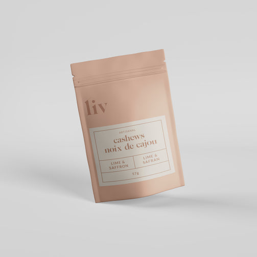 Premium lime and saffron cashews by LIV, delicately roasted for a vibrant flavour fusion; showcased in sleek, minimalist packaging with a golden accent.